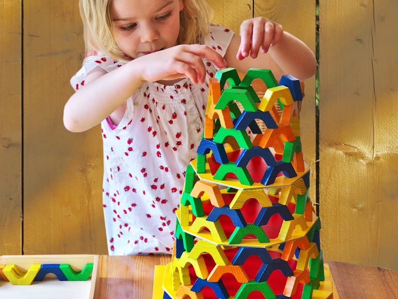 Child building with colorful blocks