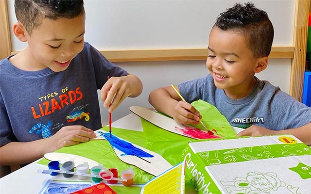 Kids engaged in hands-on educational craft activity