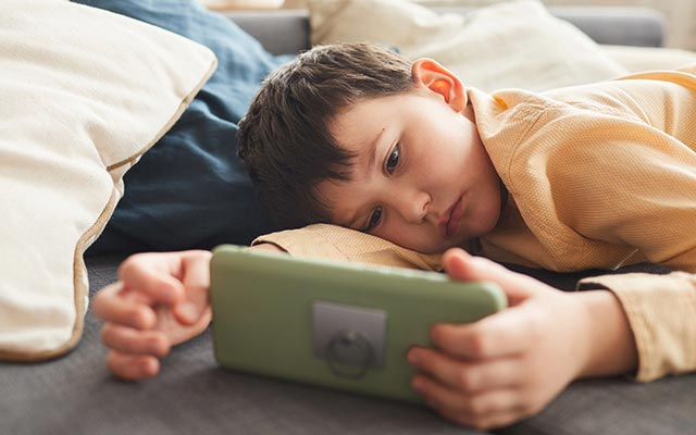 Child staring at a screen