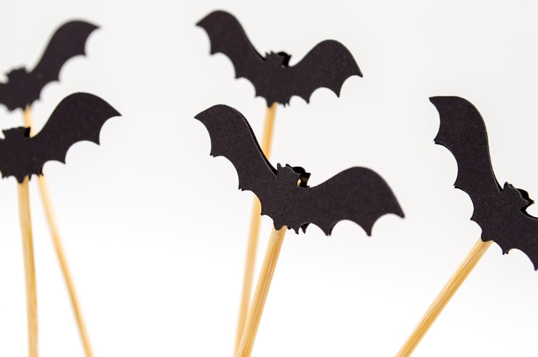 Child with Halloween bat decorations craft