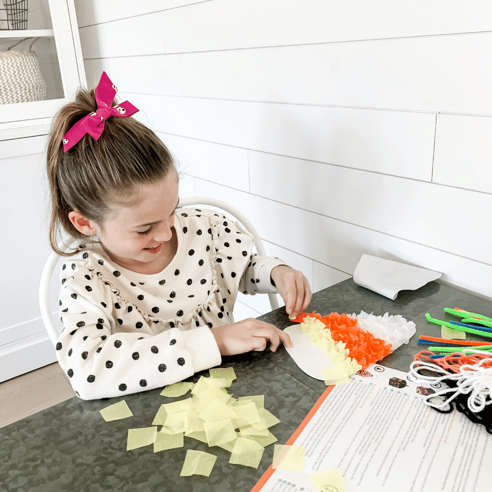 Explorer kid with Halloween craft project