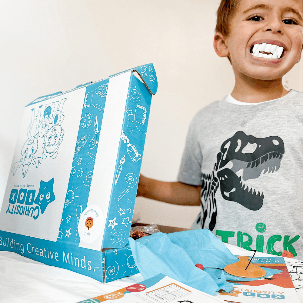 Kids enjoying Halloween extreme craft box