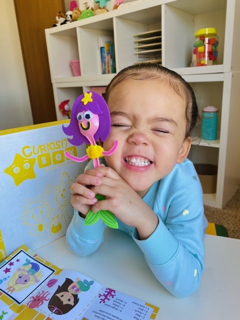 Child enjoying summer craft activity