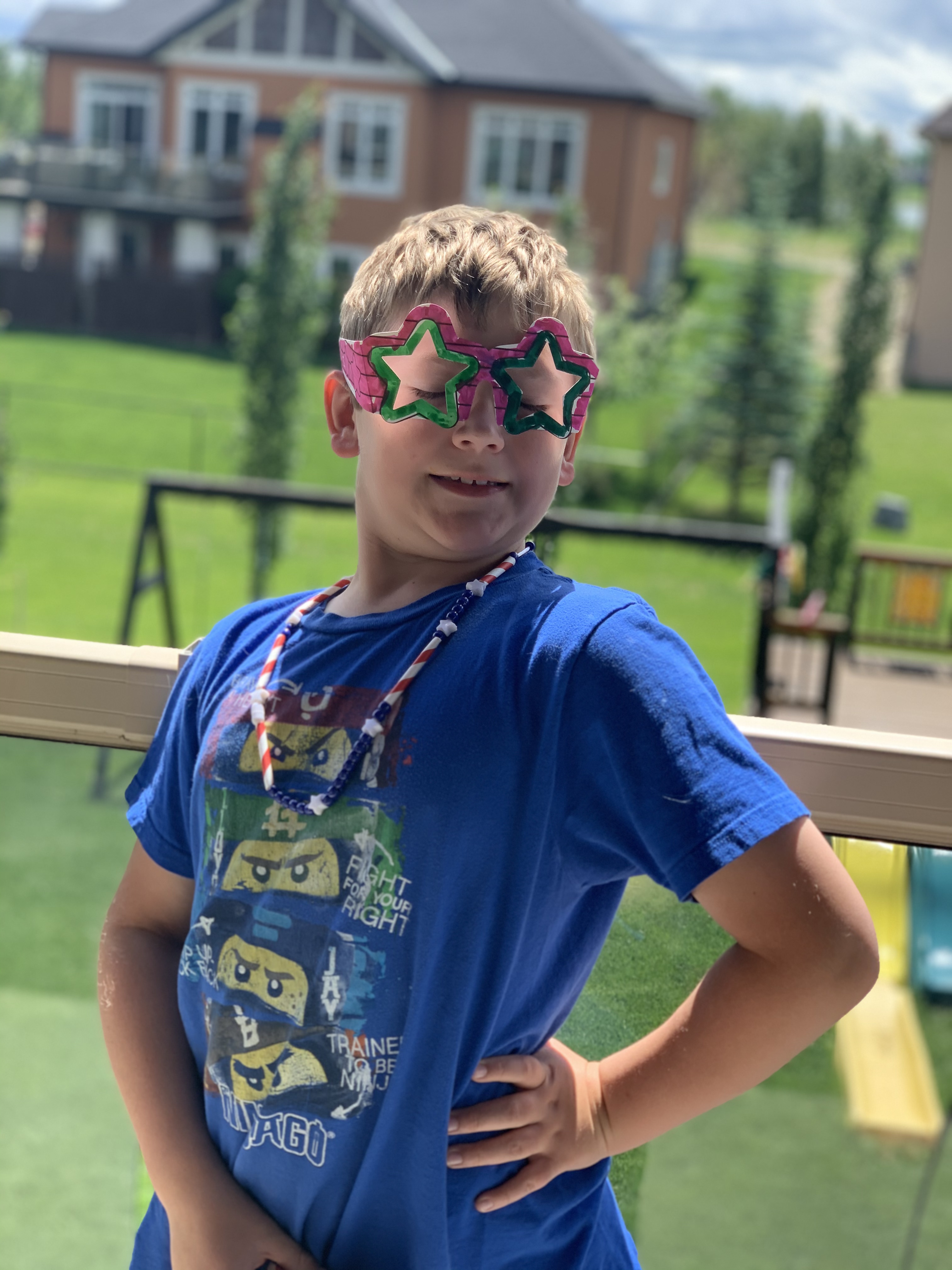 Child holding summer themed craft