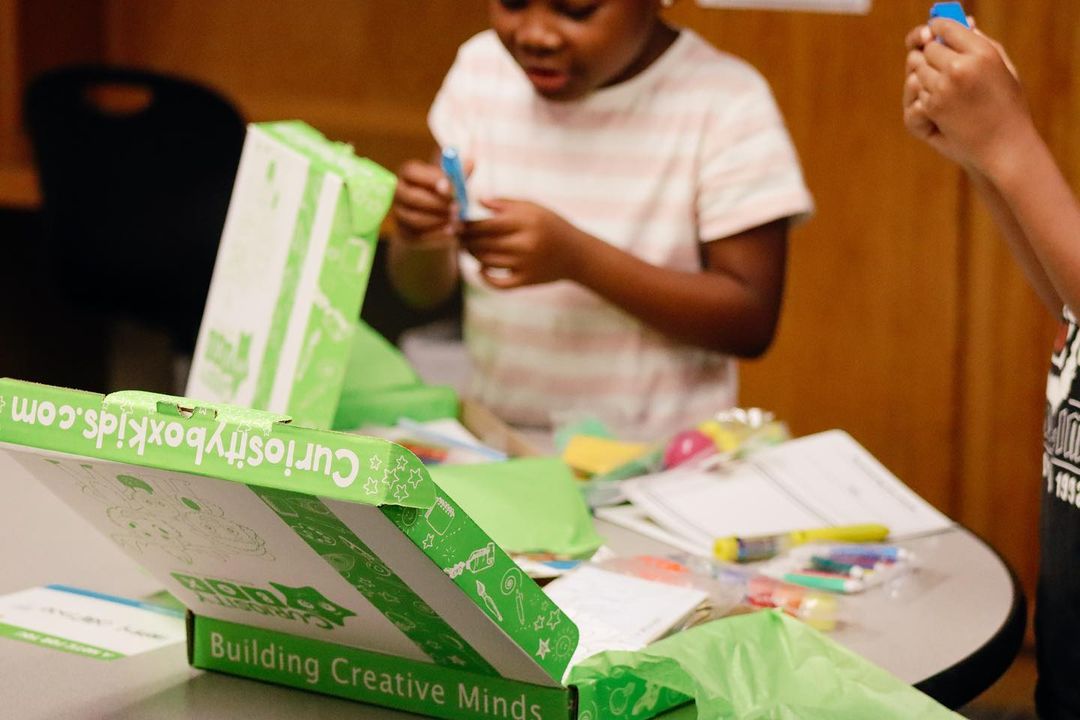 Child with completed summer craft