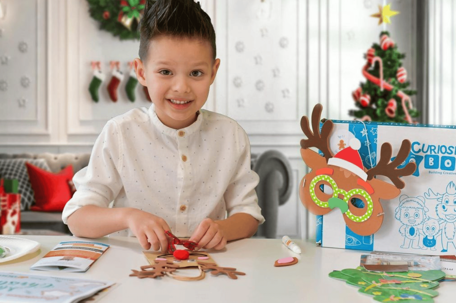 Kids showing off Christmas craft creations