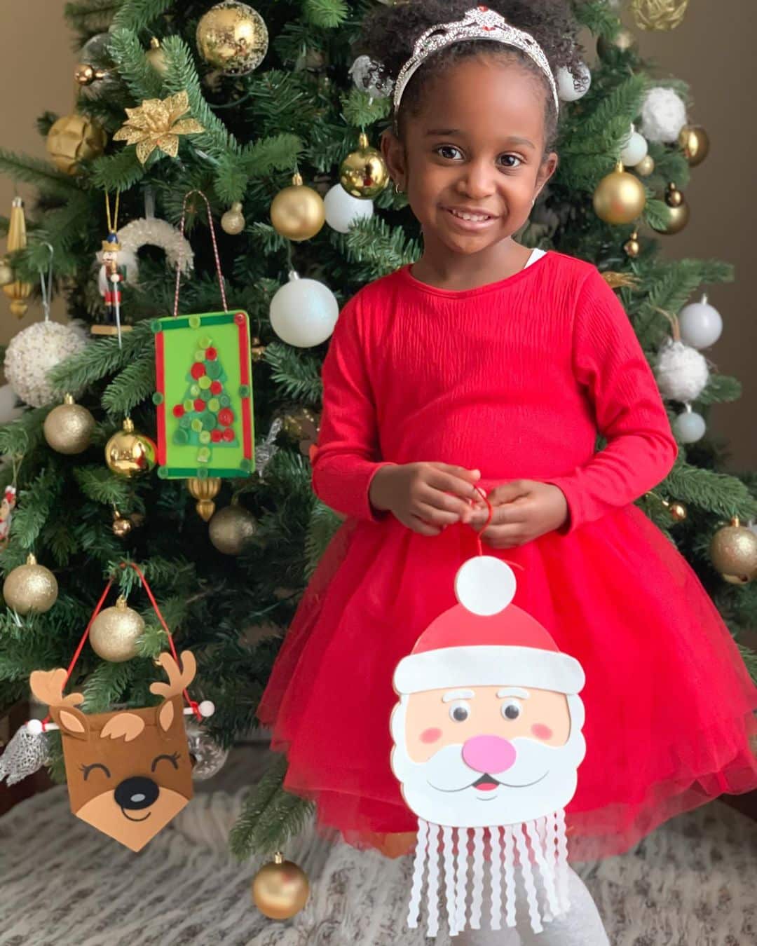 Child with holiday themed craft project